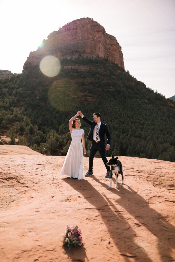 A bride and groom share a first dance at their elopement location.
