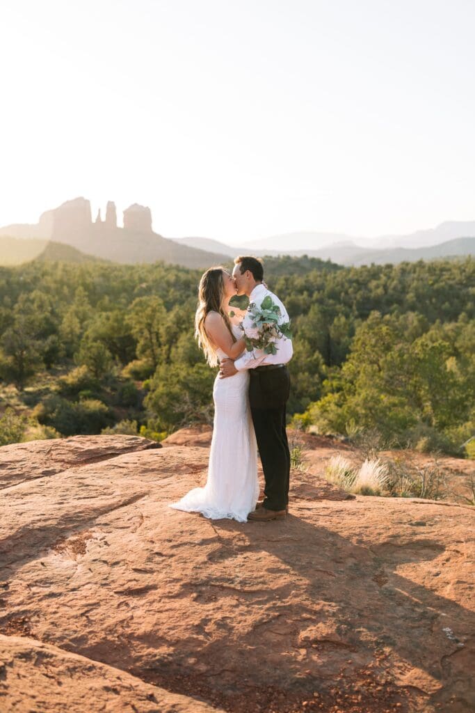 Romantic elopement portraits at Bell Rock in Sedona during sunset