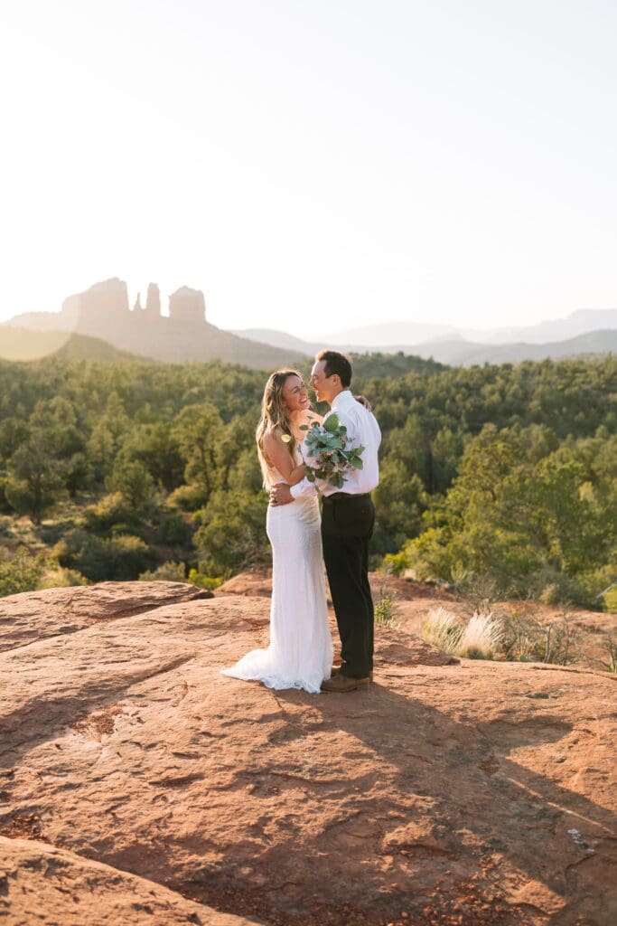 Romantic elopement portraits at Bell Rock in Sedona during sunset