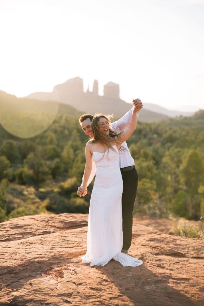 Romantic elopement portraits at Bell Rock in Sedona during sunset