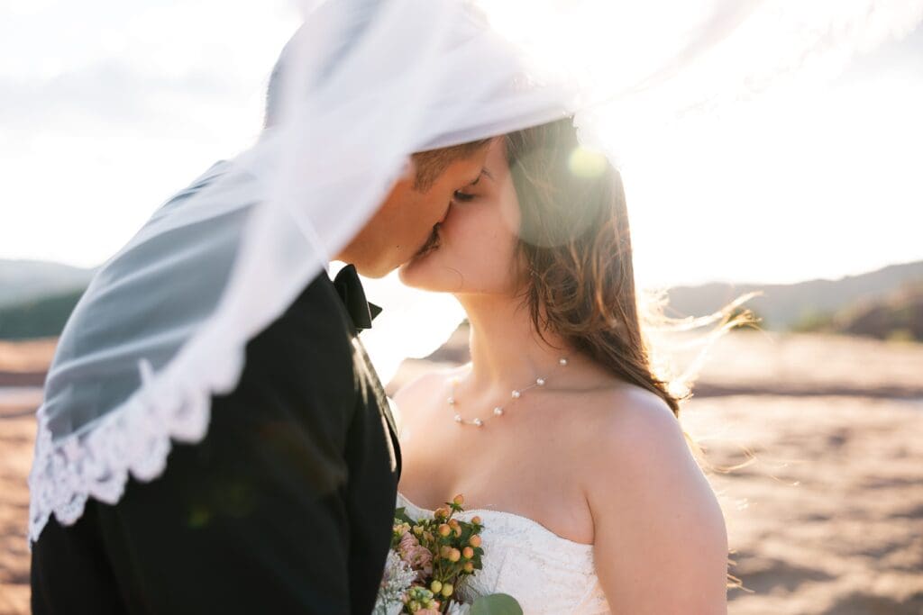 A stunning bridal veil shot at sunset during an October elopement in Sedona at Secret Slickrock.