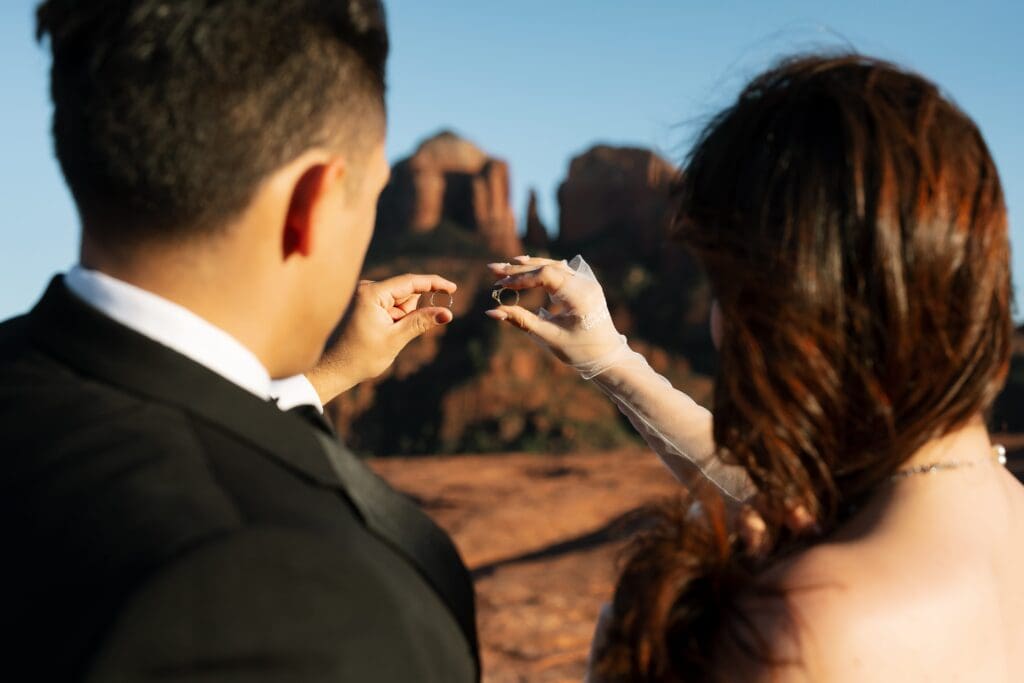 Intimate vow exchange during a Sedona elopement at Secret Slickrock, a no-hike wedding location.