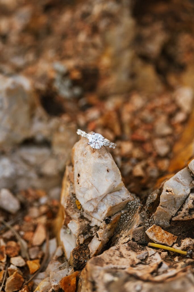 A wedding band with a rock from that is representative of the Grand Canyon.
