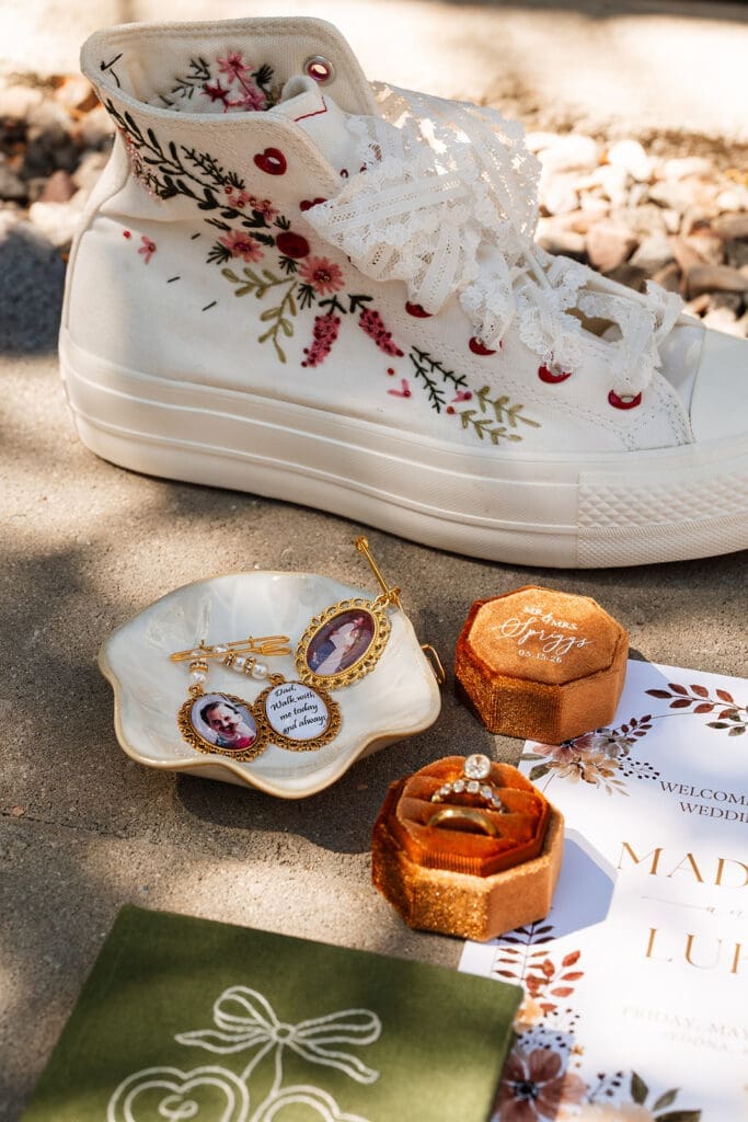 A bride embroidered her own Converse shoes and we included them in her flat lay!