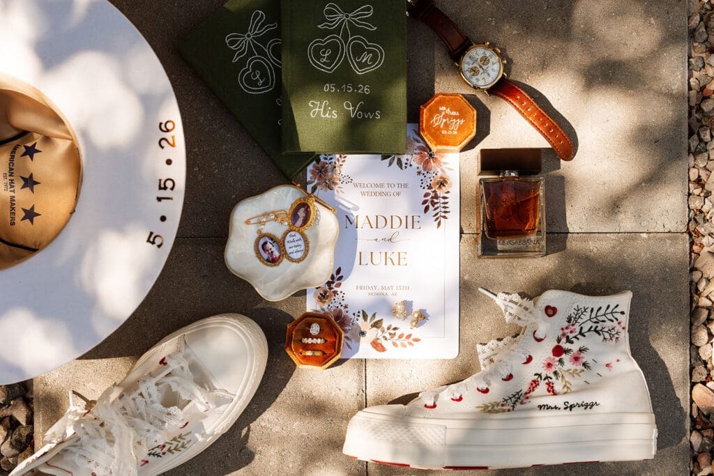 Elopement flat lay checklist details including vow books, wedding rings, and invitation suite.