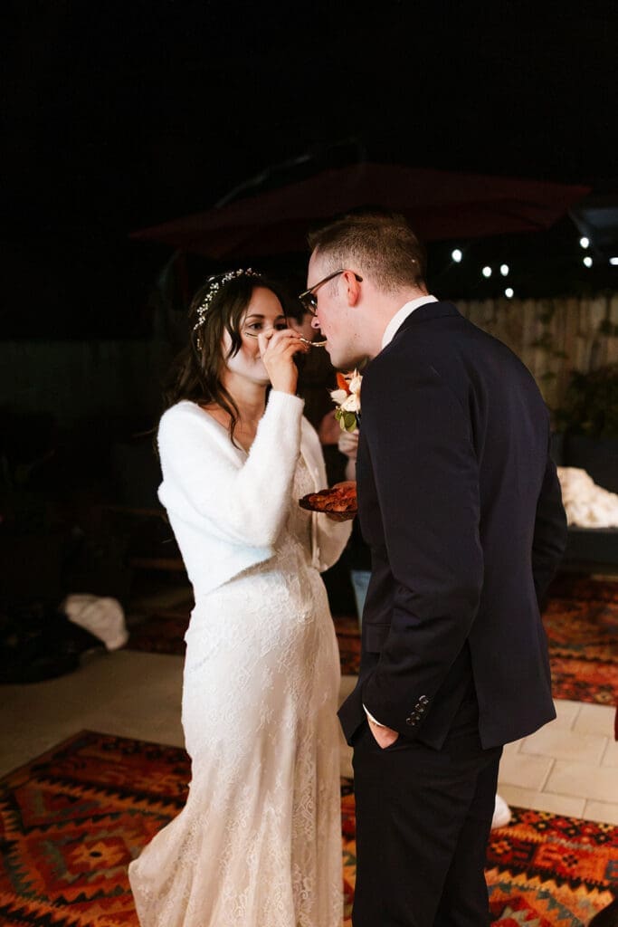 Back view of the groom embracing his bride during their emotional first dance at an outdoor Sedona reception