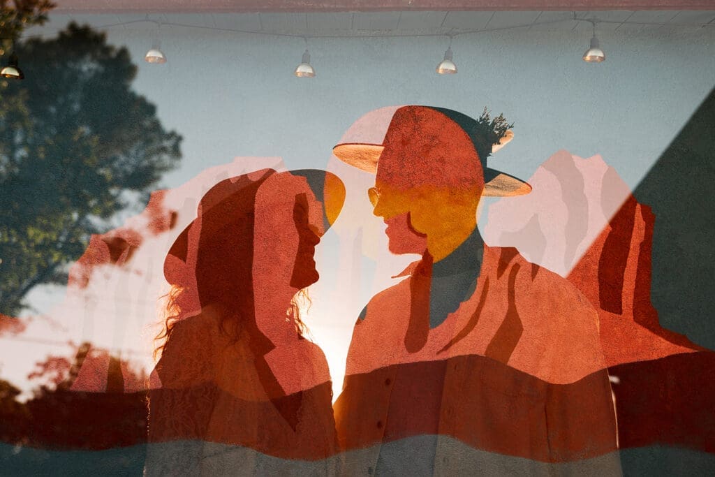 Artistic double exposure photo of the bride and groom looking at each other, overlaid with warm Sedona red rock textures.