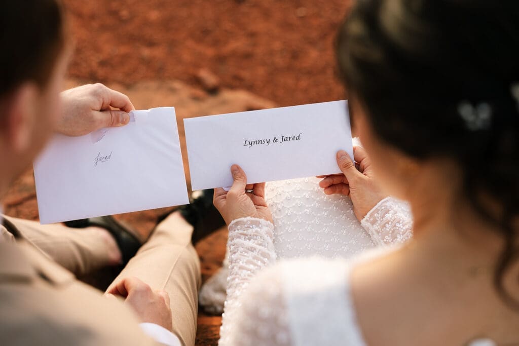 Close-up of handwritten letters from family to the bride and groom.