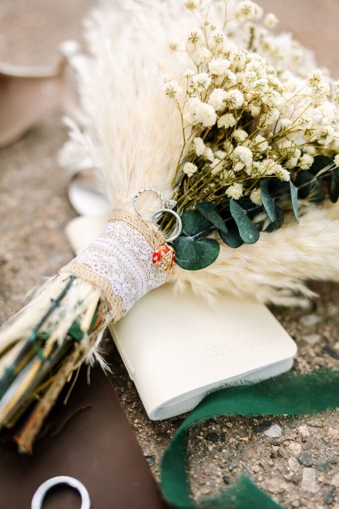 A bouquet has a charm from the brides grandmother.