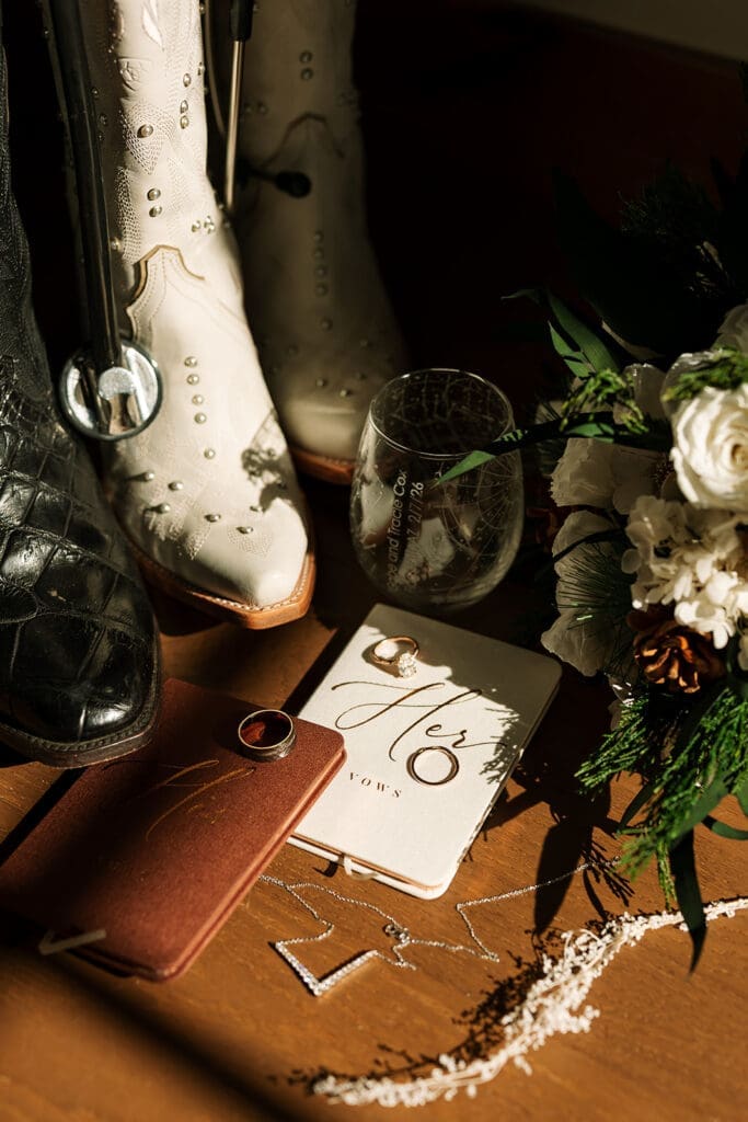 A flat lay that includes personal touches including cowboy boots.